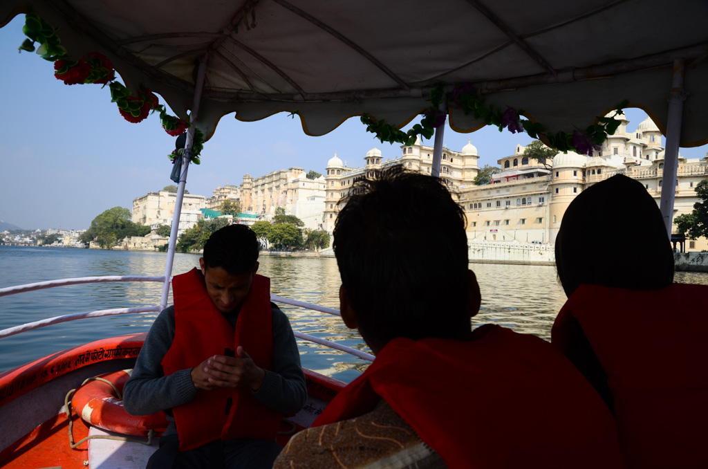 My forgettable view on our Lake Pichola boat ride. Udaipur City Palace, conveniently located behind tourists heads.
