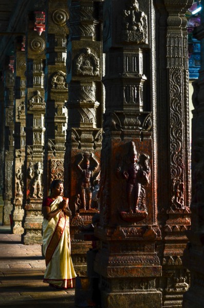 A woman prays to Hanuman, the monkey god.