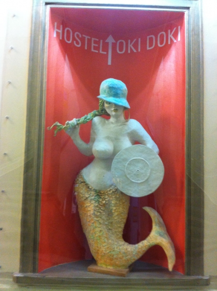 The Coat of Arms of Warsaw consists of a syrenka ("little mermaid") in a red field. Some mermaids may appear to have undergone more cosmetic surgery than others.