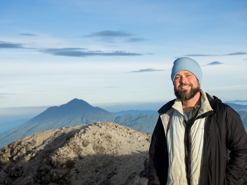 Man on summit of Tajumulco in blue hat. GreatDistances.com