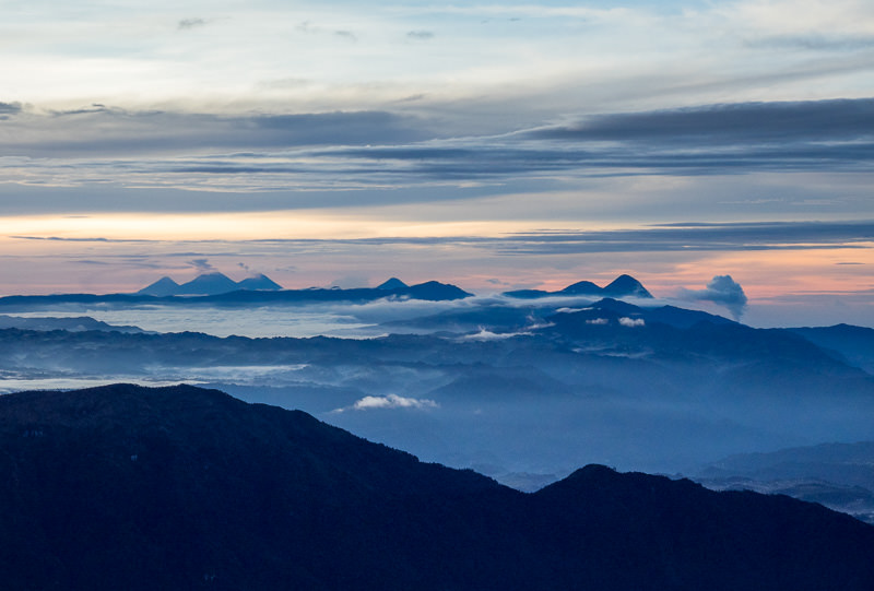 A horizon full of active volcanoes. Sunrise atop Volcán Tajumulco. GreatDistances