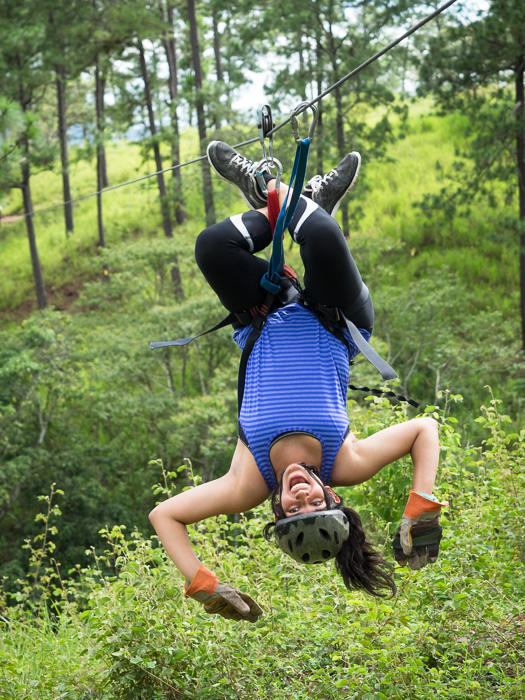 Woman ziplining in Copan, Honduras. GreatDistances / Matt Wicks