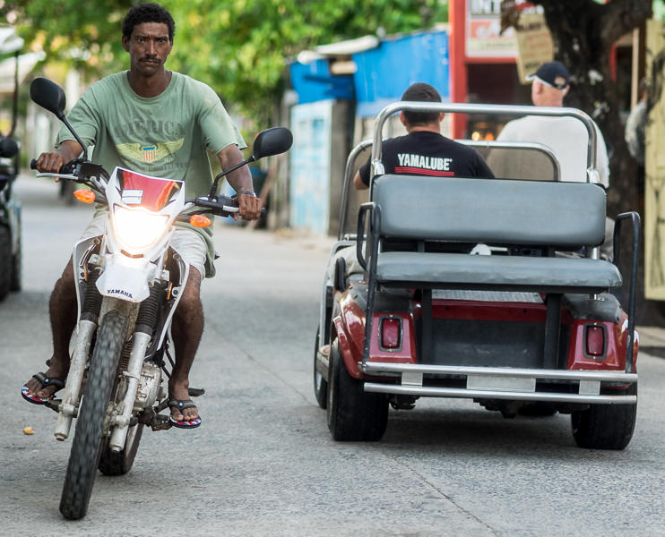 swerving out of a near miss at high speed on Utila Town's main road. GreatDistances / Matt Wicks