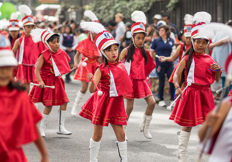Young drum majorettes in a parade in Xela, Guatemala. Guatemalan Independence & Xela Feria 2014 - GreatDistances / Matt Wicks