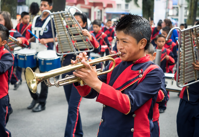 Young trumpet player in an independence day parade in Xela, Guatemala. Guatemalan Independence & Xela Feria 2014 - GreatDistances / Matt Wicks