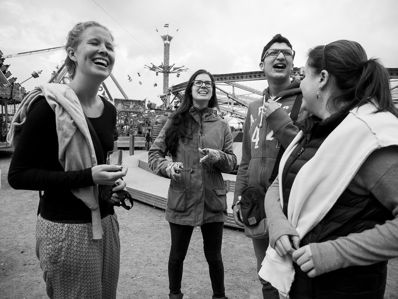 Friends smiling and laughing at Xela Feria in Quetzaltenango, Guatemala. Guatemalan Independence & Xela Feria 2014 - GreatDistances / Matt Wicks