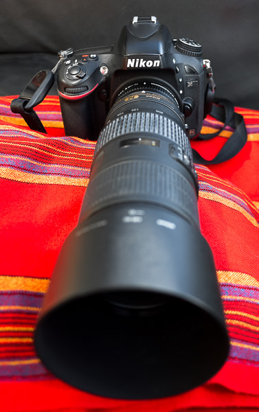 The Nikon D610 with Nikkor 70-200mm f/4 VR and Nikkor TC-14E III teleconverter mounted, on a Maasai blanket, inside our jeep. (I bought the lens used, and the zoom ring barrel has always been chalky-looking for some reason - but image quality is unaffected. Weird.) GreatDistances / Matt Wicks