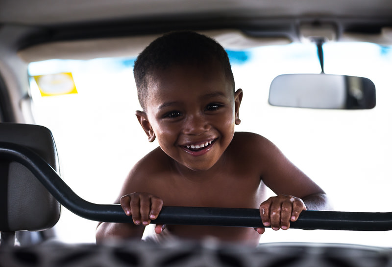Smiling young boy in matatu. Lamu, Kenya. One Month in Kenya - GreatDistances / Matt Wicks