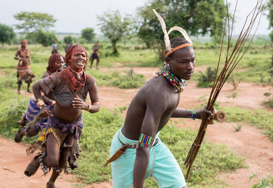 Hamar women running after whippers or maza at a Hamar Bull Jumping Ceremony. South Omo Part 2 - GreatDistances / Matt Wicks