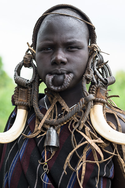 Mursi woman with pierced lip. Photographing the Tribes of South Omo, Ethiopia - GreatDistances / Matt Wicks
